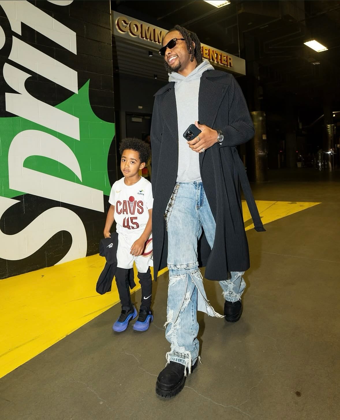 Darius Garland wearing an Issey Miyake trench coat