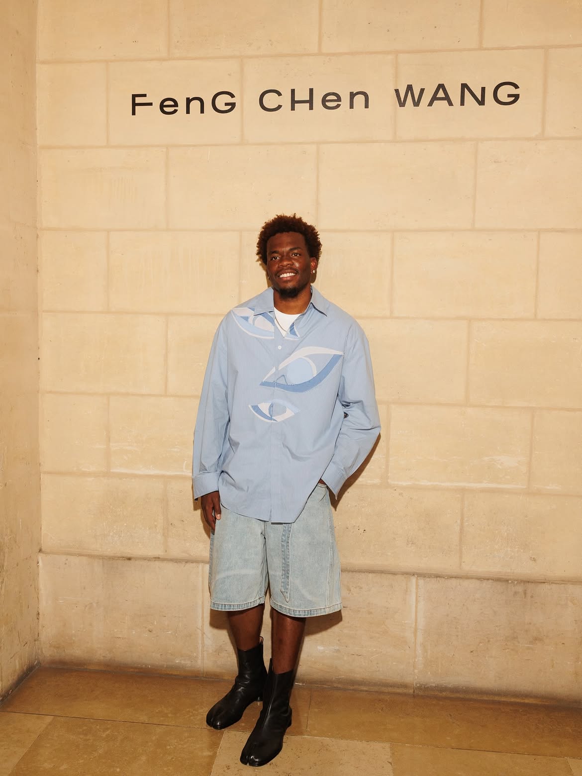 Davis Dodds at the Feng Chen Wang show during Paris Fashion Week, dressed in Feng Chen Wang