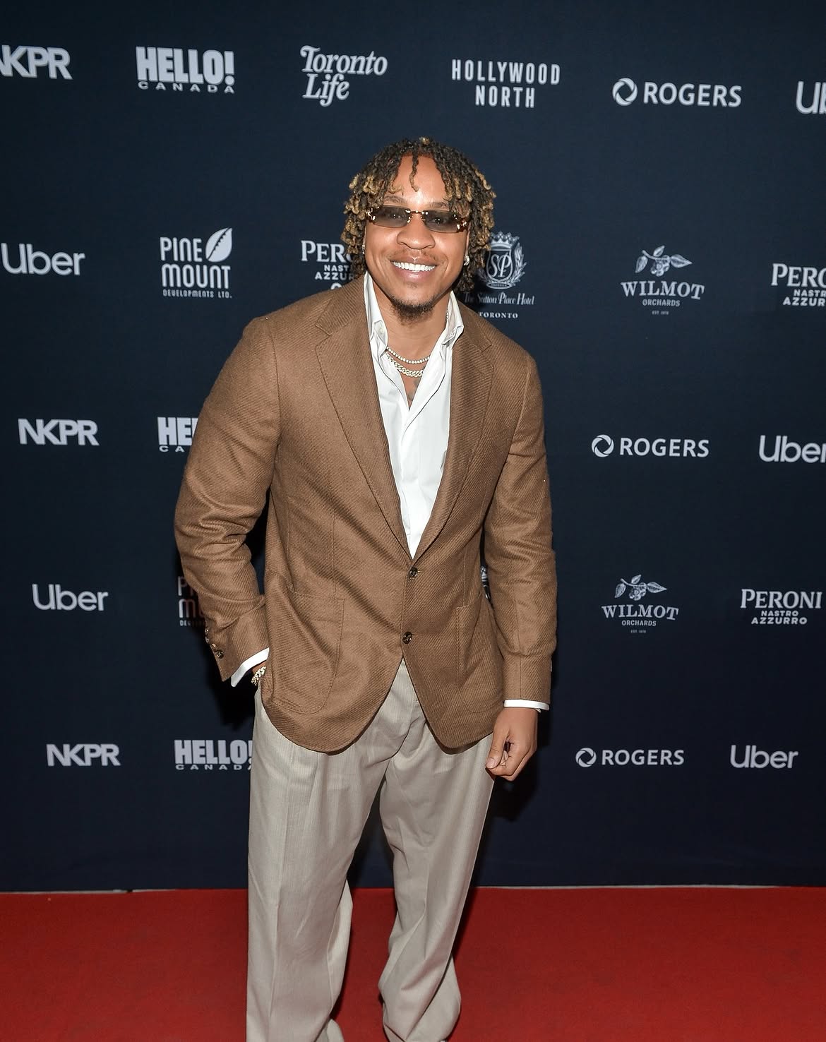 Rotimi at the TIFF Film Festival red carpet, wearing Canali